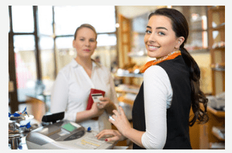 A girl standing on the cash counter